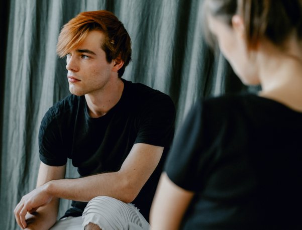 young adult man at a counseling session
